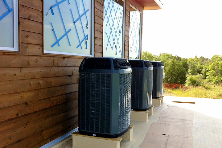 Trane units lining the outside of a building